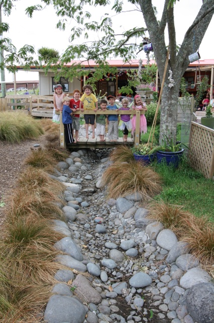 Lessons about water sustainability are a feature at Te Puna Kindergarten, where a river runs through their playground, fed by a rainwater tank. 